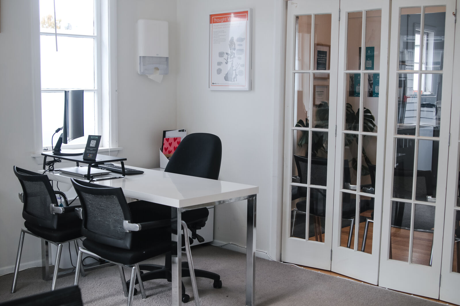 A bright, modern treatment room at a Restore Hand Therapy clinic in Upper Hutt